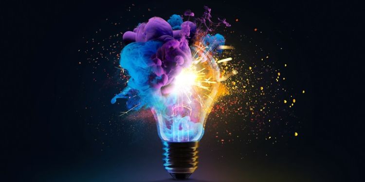 Exploding lightbulb with purple and blue cloud