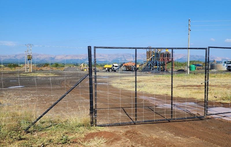 Mining operation behind a fence