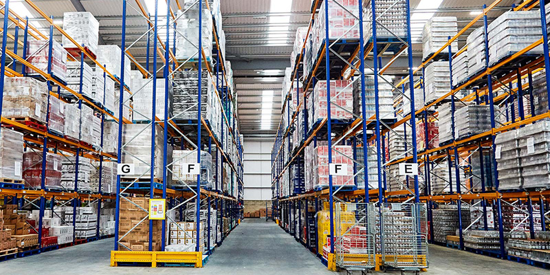 Inside a warehouse with tall shelves