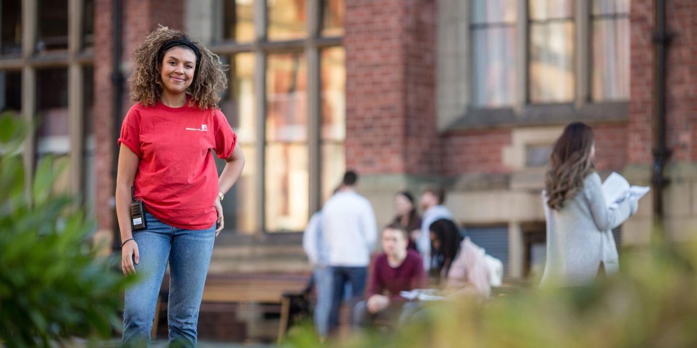 Student ambassador stood outside The Great Hall during an Open Day