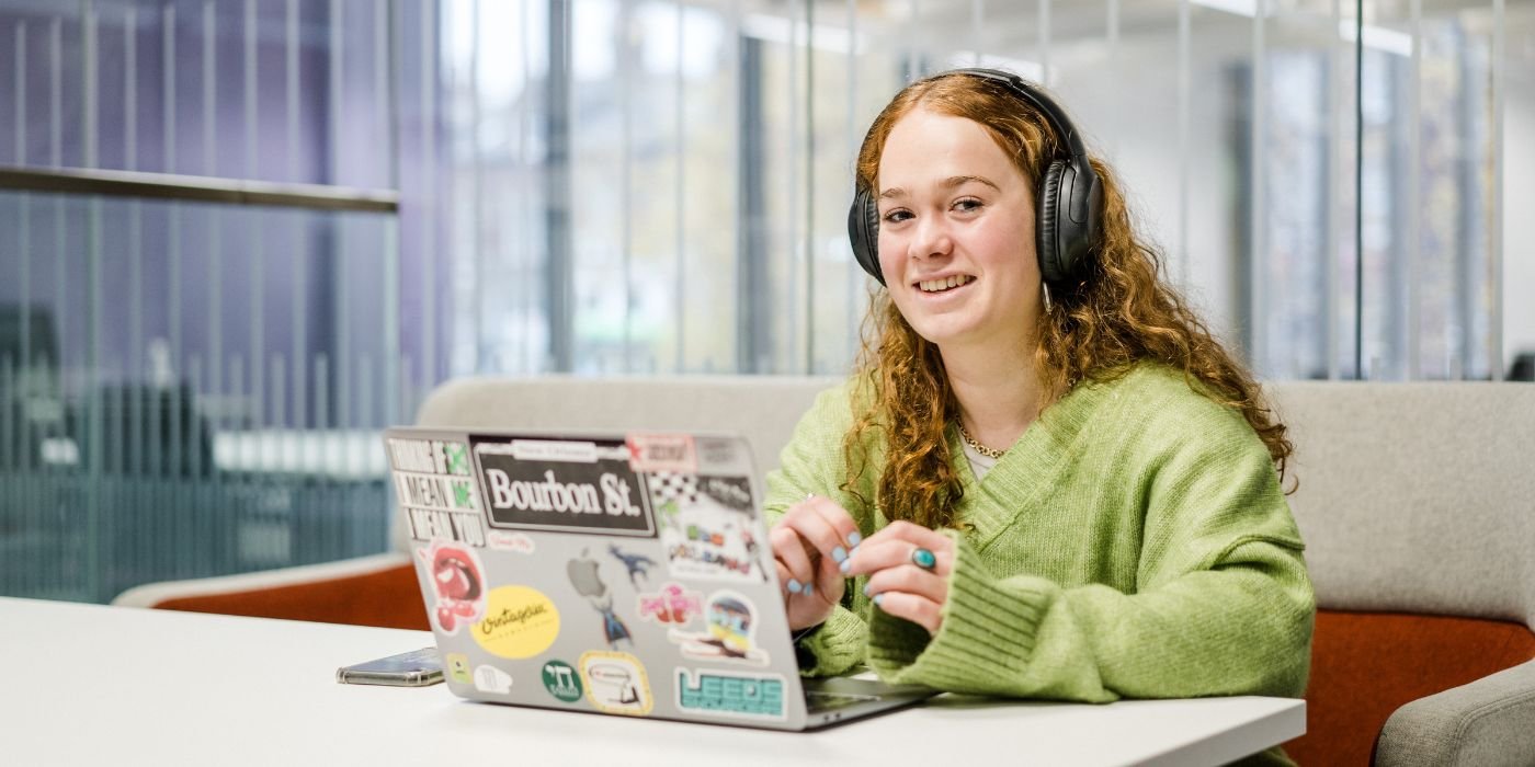 Student sat in front of laptop