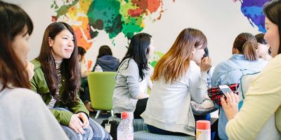 Students sitting in the Leeds University Business School's Global Lounge