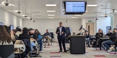 Puneeth Sudheendra speaking to MBA students