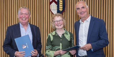 Andrew Pendleton and Andrew Robinson holding their awards, with Ruth Sawtell stood in the middle