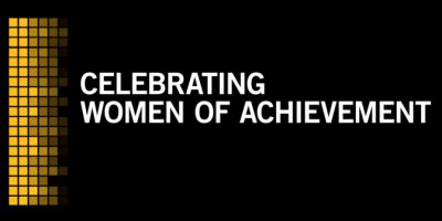 Text reading Celebrating Women of Achievement on black background