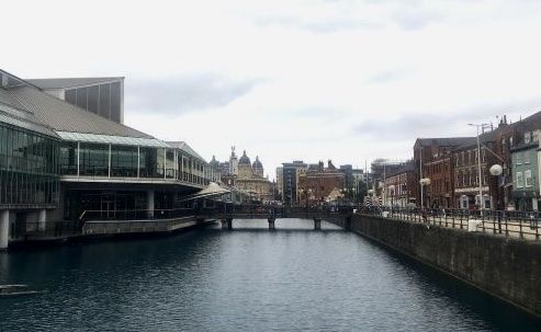 Bridge in Hull with a building on one side and street on the other