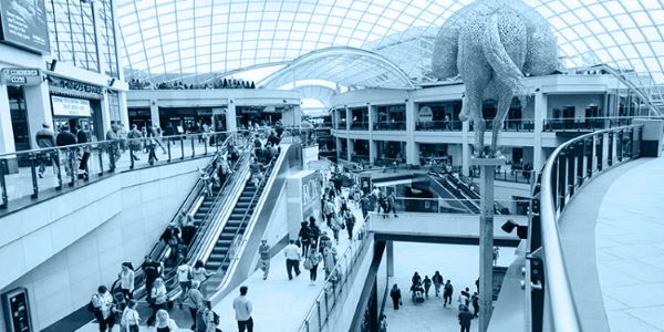 Inside a shopping centre, with a blue overlay on top