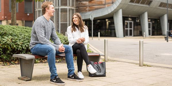 Two students outside the Charles Thackrah building