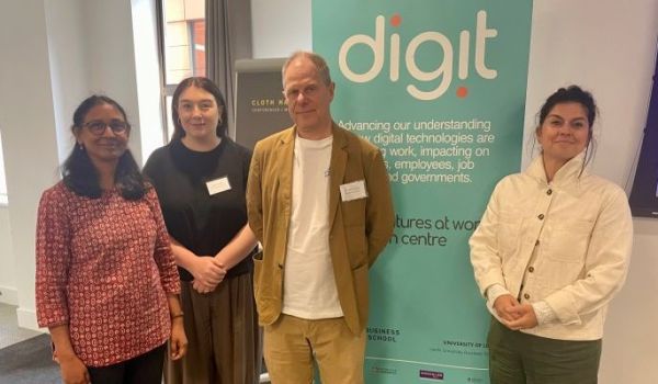 Uma Rani, Esme Terry, Mark Stuart and Ioulia Bessa stood by "digit" pull-up banner.