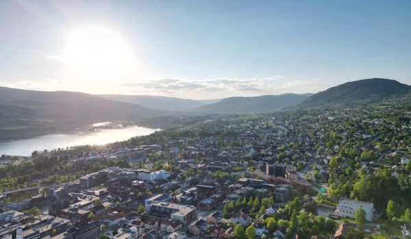 Aerial view of Lillehammer, Norway, showing buildings, the river and hills