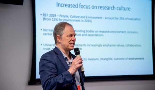 Professor Mark Stuart presenting at the Research Conference