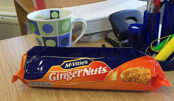 Pack of McVities Ginger Nuts laying on a desk