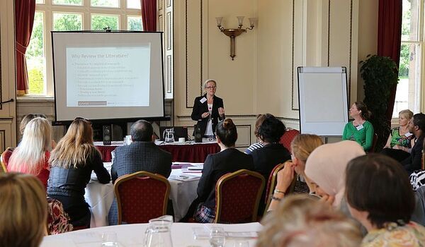 Photograph of Professor Caroline Gatrell presenting at a NARTI conference