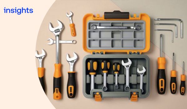 An open toolbox with tools laid out neatly around and inside it
