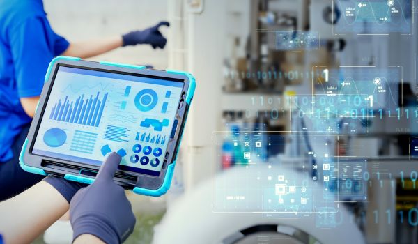 Mixed media of engineer inspecting factory machines and piping and digital technology concept