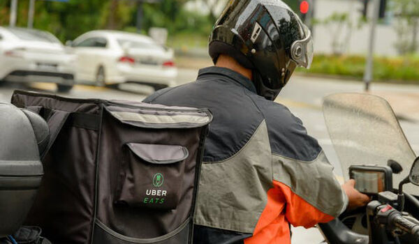 Photograph of an Uber motorcycle delivery rider
