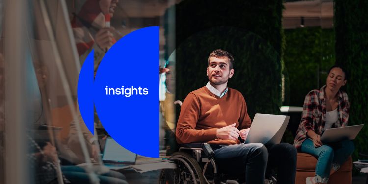 People working together in a modern office setting with laptops and collaborative seating. There is a blue overlay with "insights" on top of it.