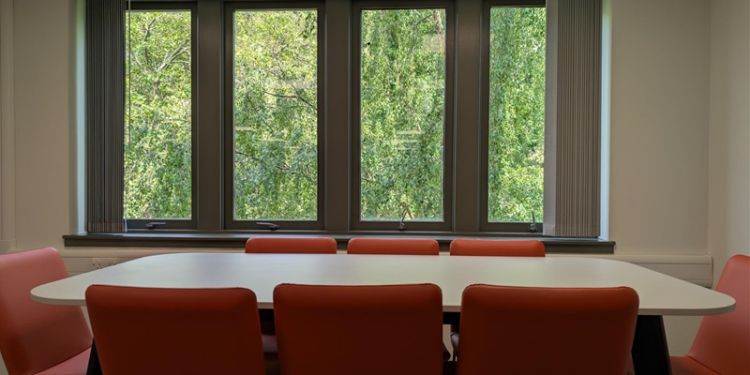Empty conference table in fron of a window