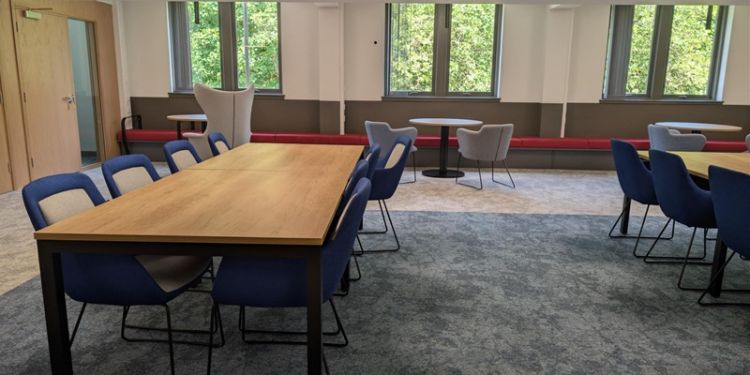 Empty tables and chairs in the MBA lounge