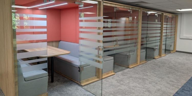 Booths behind glass in the MBA lounge