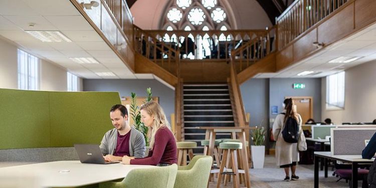 Postgraduate private study room with wooden beams and stained glass windows