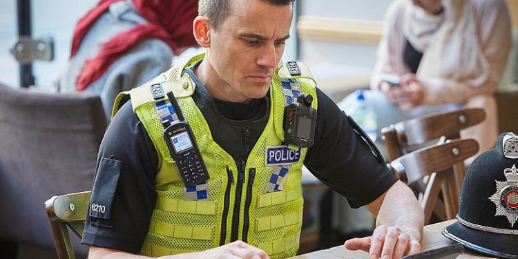 Police officer working on a tablet