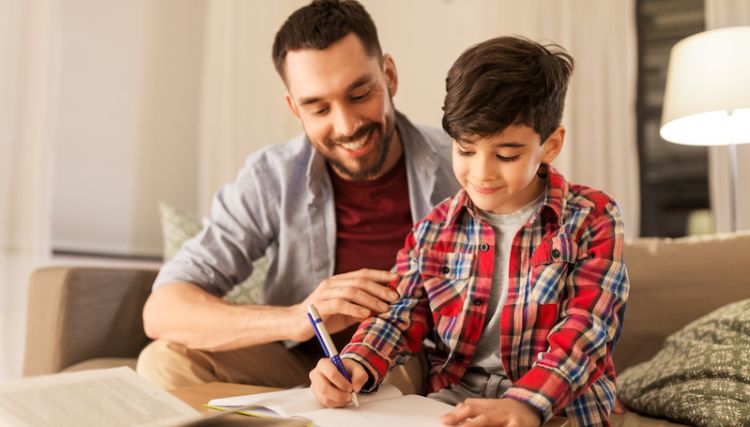 Father helping son with school work