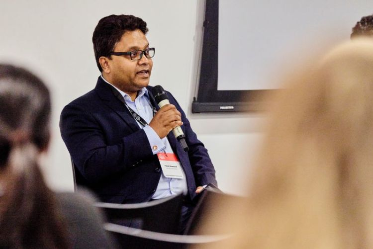 Faisal Ahammad speaking into a microphone