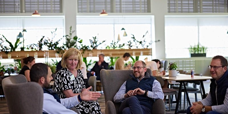 Four business people networking in Esther Simpson cafe