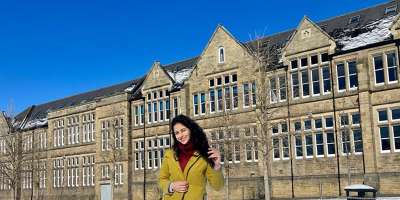 Sanya kaushal stood in front on maurice keyworth building