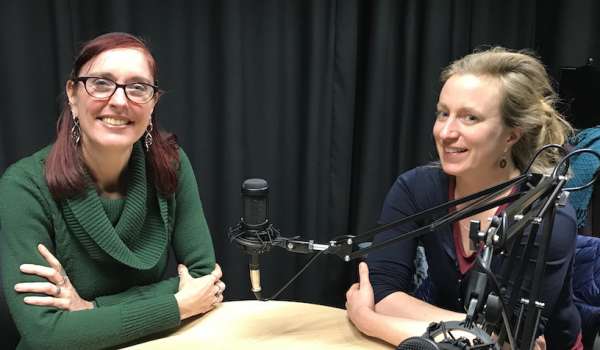 Wandi Bruine de Bruin and Astrid Kause sat at a table with microphones
